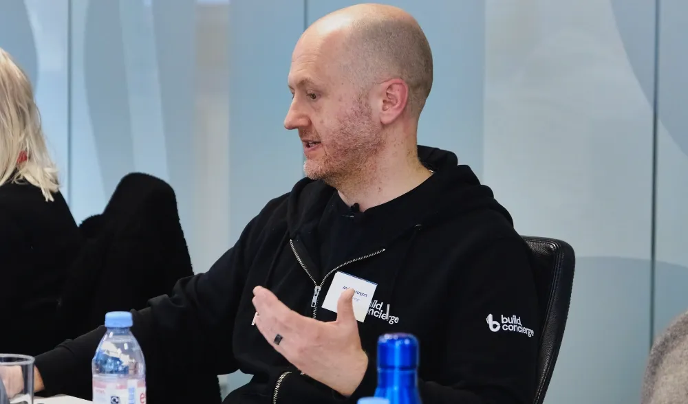 A Build Concierge employee in a meeting