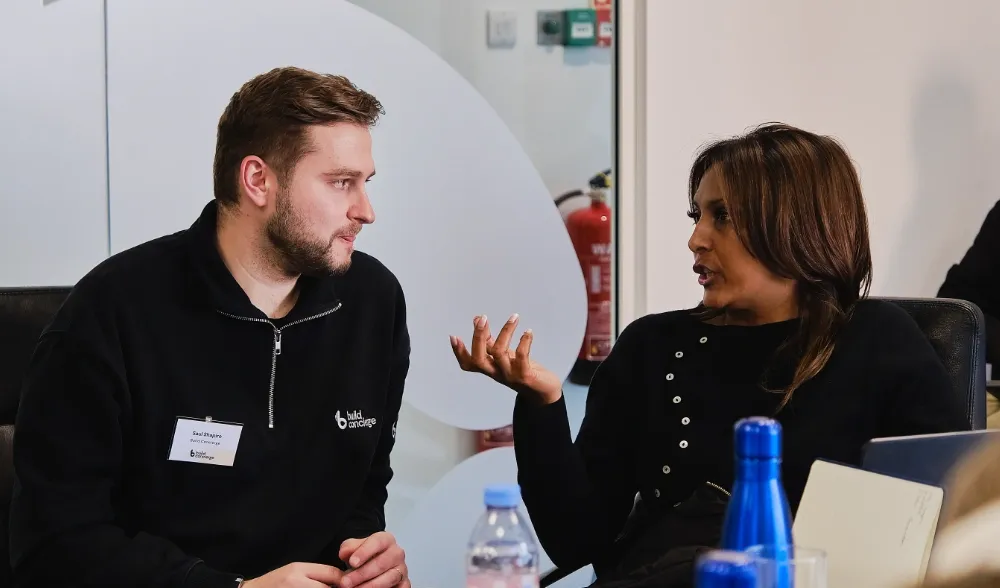 A Build Concierge team member listing to a customer 